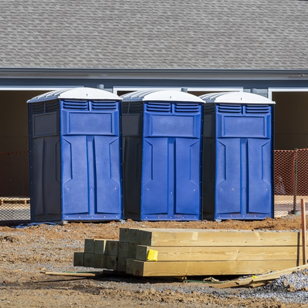 what is the cost difference between standard and deluxe porta potty rentals in Russell